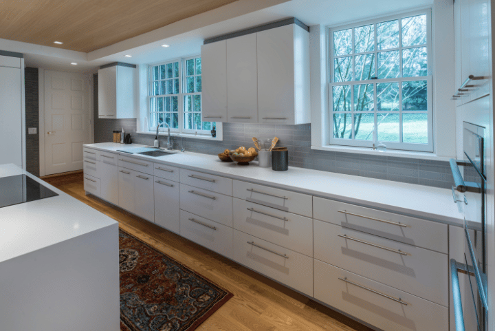modern kitchen remodel with white countertops by Penn Contractors modern kitchen remodel with white countertops by Penn Contractors