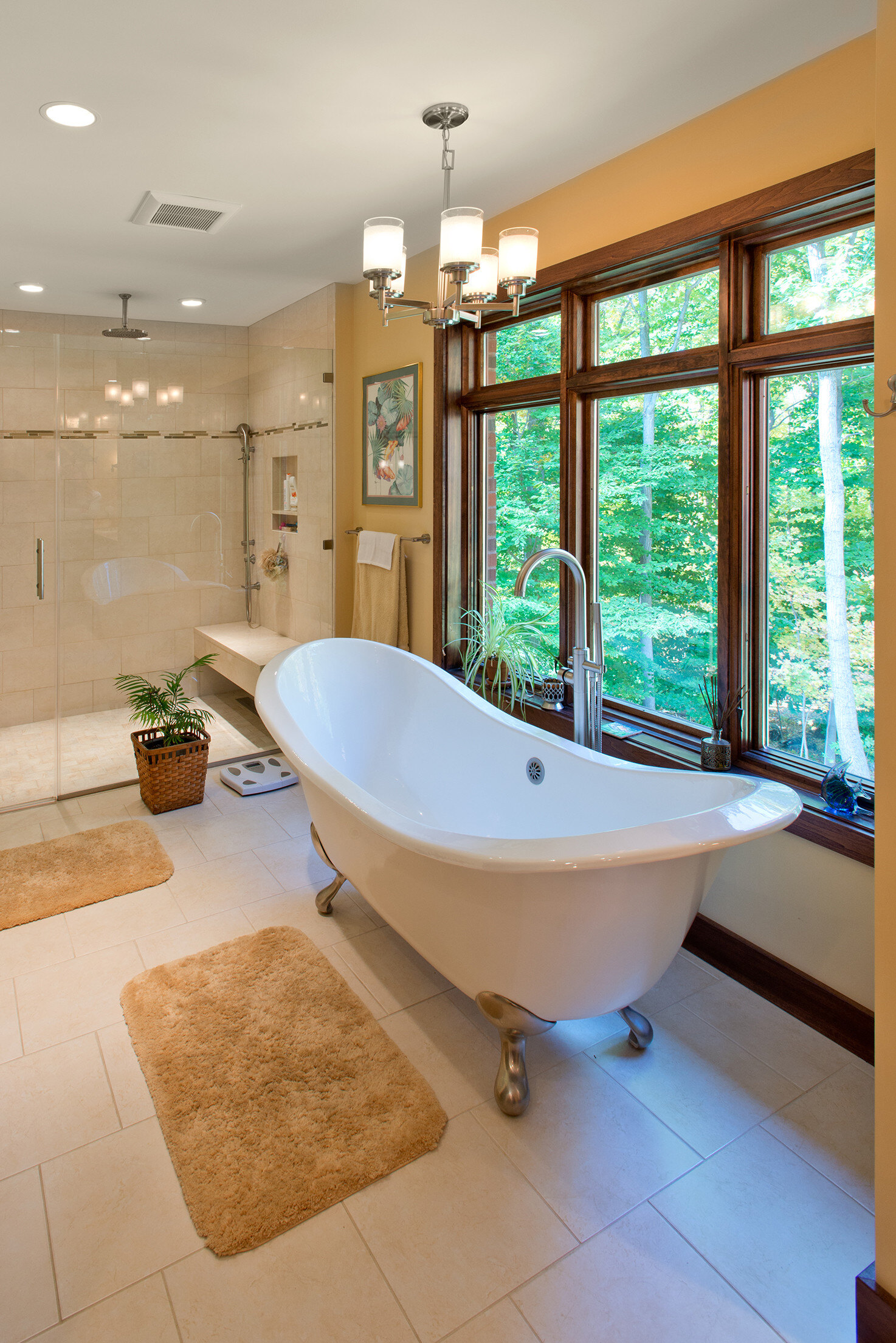 free standing tub and rain shower with glass enclosure