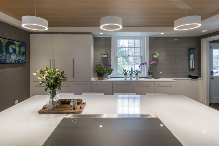 modern kitchen remodel with white countertops and unique light fixtures by Penn Contractors modern kitchen remodel with white countertops and unique light fixtures by Penn Contractors